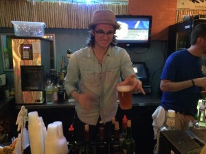 Paul Pfau pouring me a beer as a "celebrity bartender" at Rock by the Sea. 